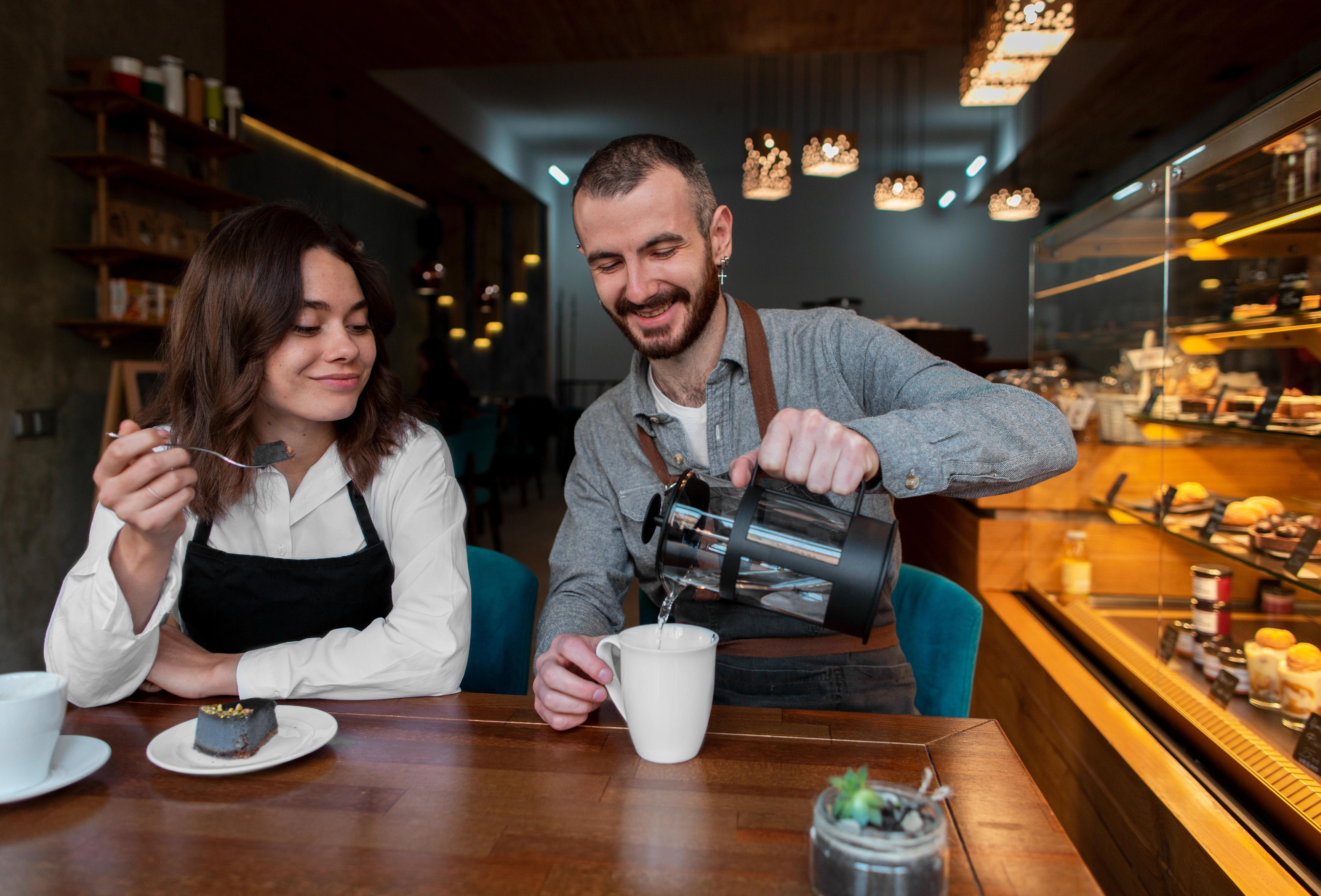 Barista making coffee in cafe